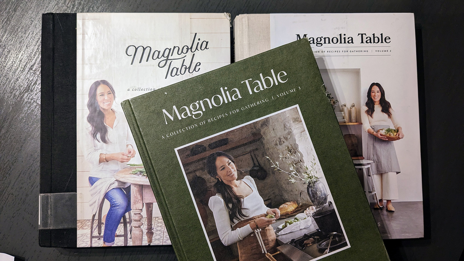 all three of joanna gaines's cookbooks, magnolia table volumes 1 through 3