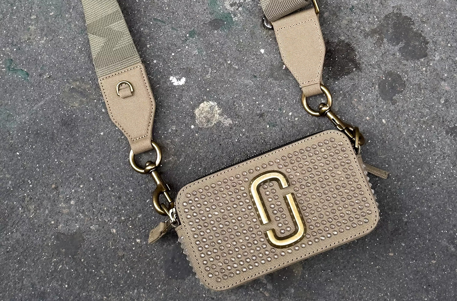 marc jacobs snapshot camera strap bag on pavement