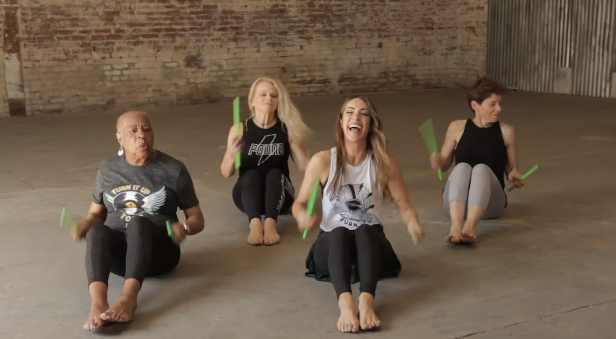 pound backstage review: four people demonstrating the cardio drumming workout
