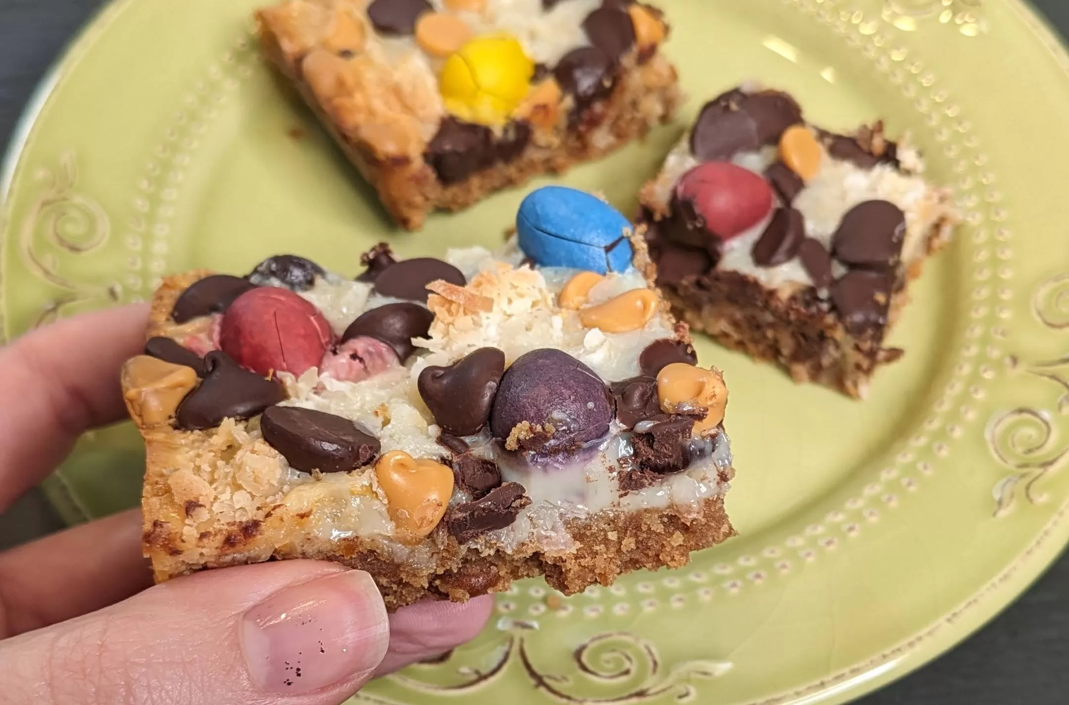 mini cadbury egg magic cookie bars held up