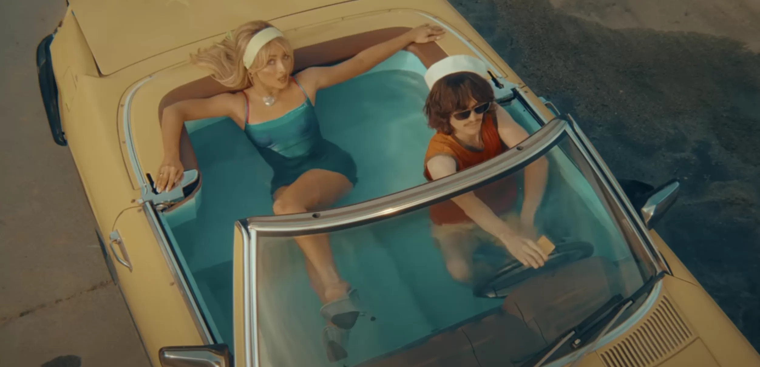 sabrina carpenter in a hot tub car in "espresso" video
